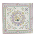 Ornamental Mor silk twill scarf, laid flat: cream silk with a pastel ornamental peacock medallion and border