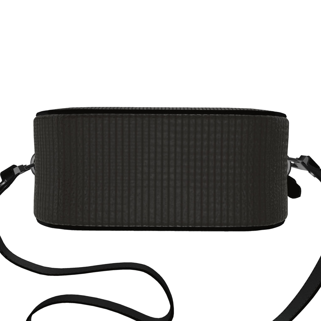 Round box bag, side view showing the depth and strap fittings