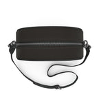 Round box bag from above with the strap laid out