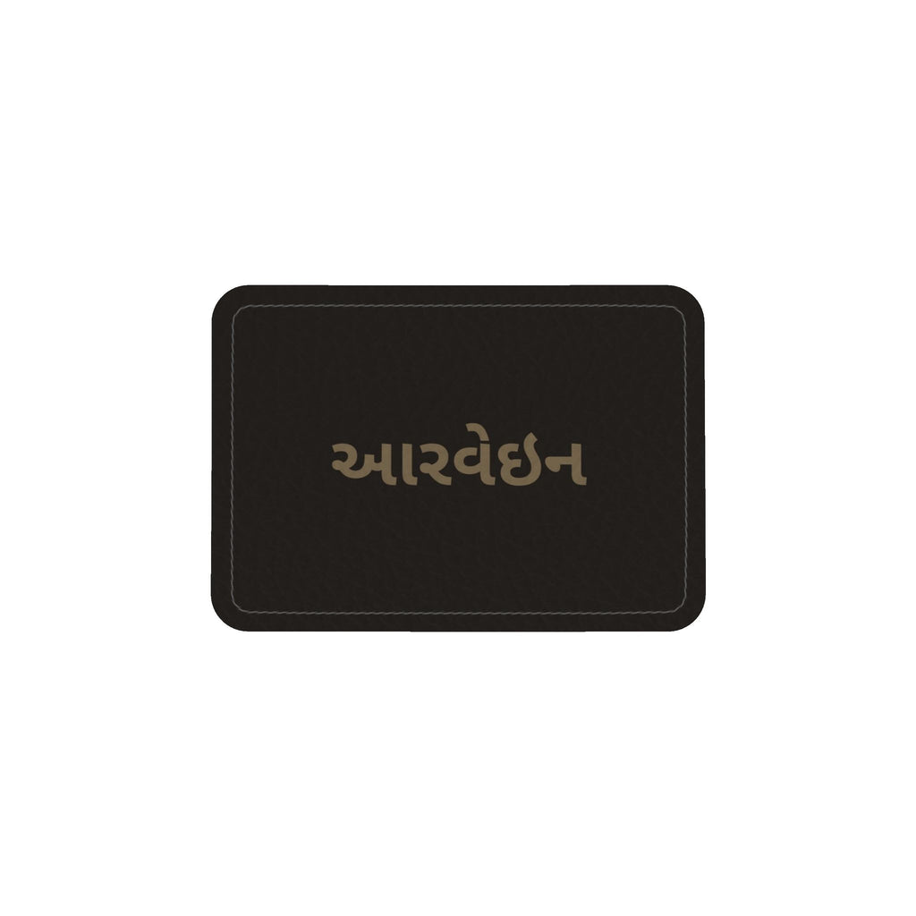 Leather label on the round box bag with the Aarvein wordmark in Gujarati, આરવેઇન