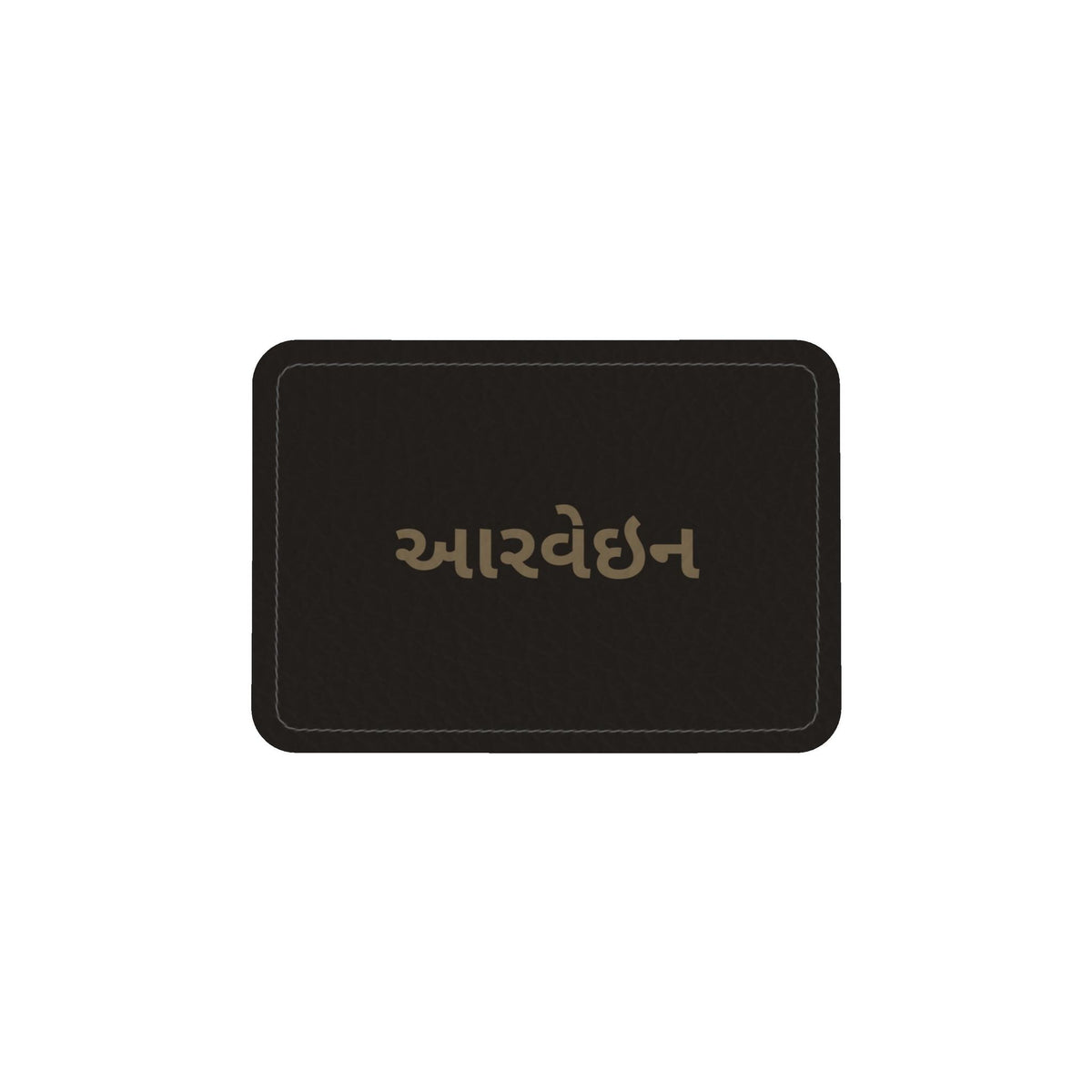 Leather label on the round box bag with the Aarvein wordmark in Gujarati, આરવેઇન