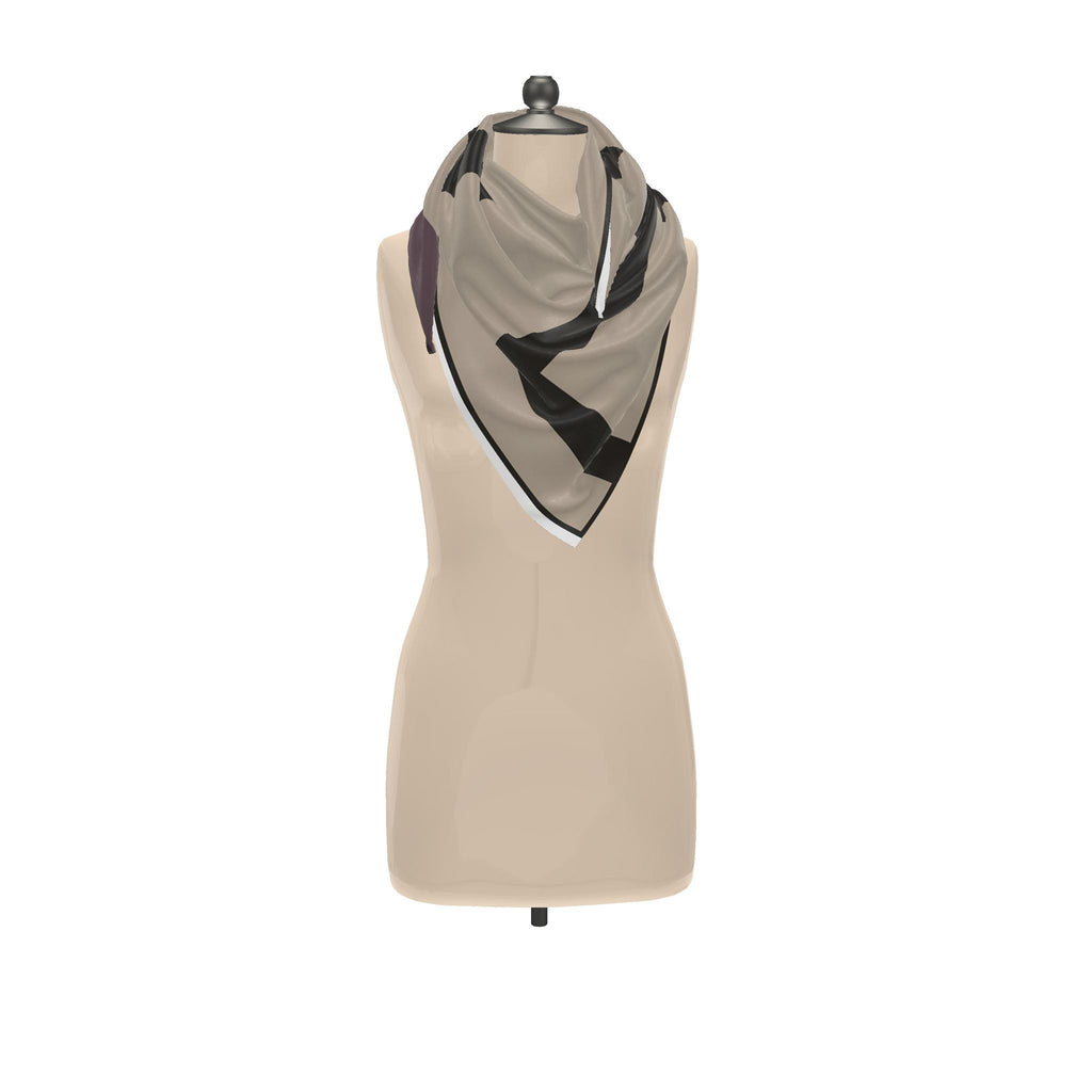 Grid silk scarf tied loosely around the neck of a dress form