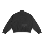 Back of the black pinstripe track jacket with small “peacock in disguise” lettering