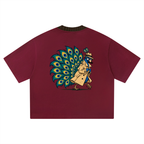 Back of the wine red boxy tee with a full-colour peacock in a trench coat, hat and fake moustache